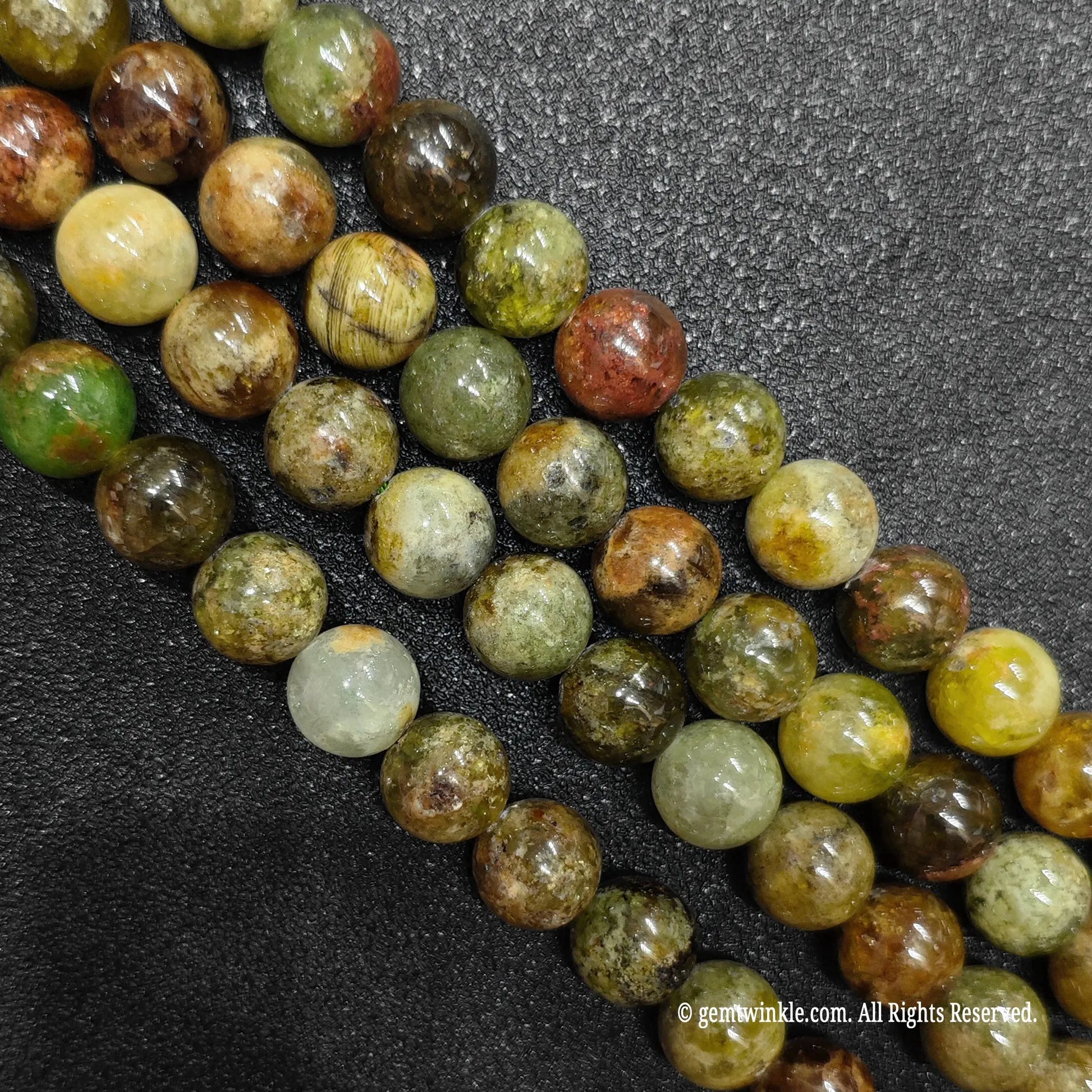 multiple loose strands of natural grade c green garnet crystal beads