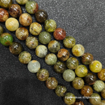 multiple loose strands of natural grade c green garnet crystal beads