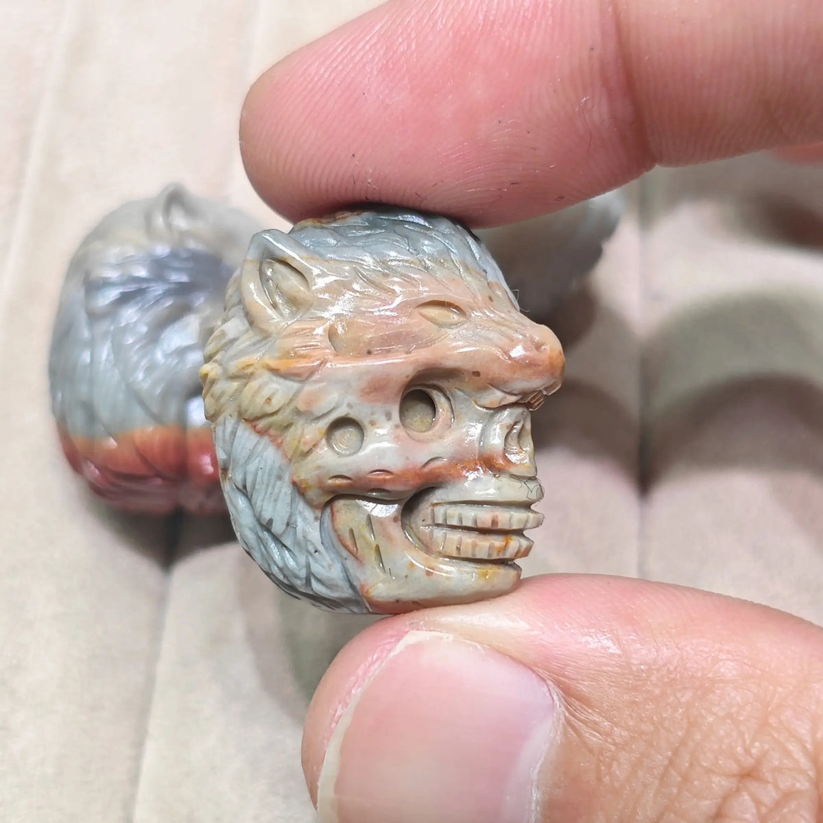 wolf-skull-carving-side-profile-red-gray