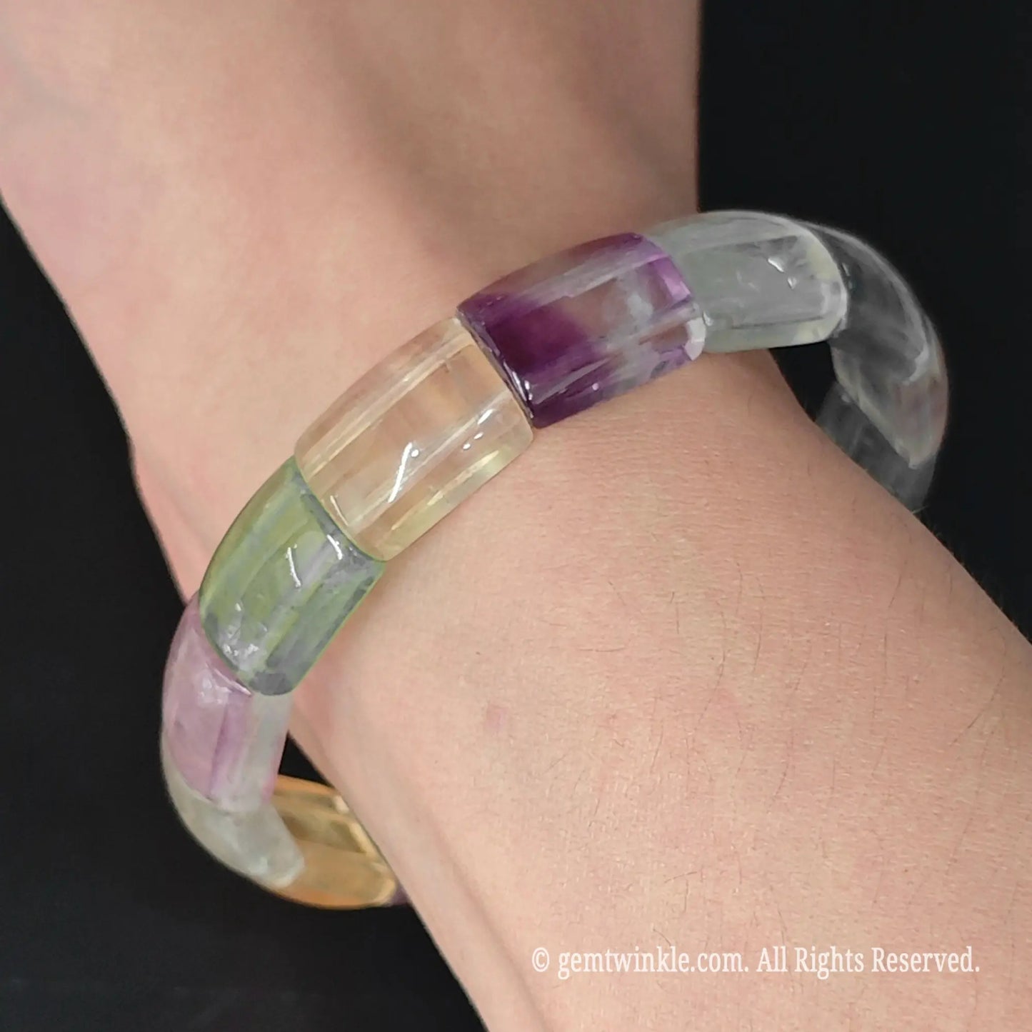 14mm smooth curved bar fluorite segment stretch bracelet worn on wrist