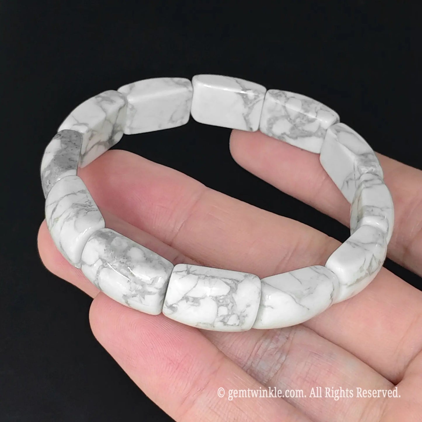 top down view of 17cm womens size white howlite stretch bangle bracelet