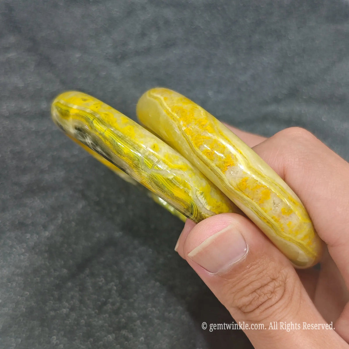 Side profile of smooth polished Bumblebee Jasper bangle bracelets showcasing solid stone thickness and inner diameter