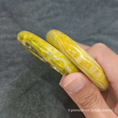 Side profile of smooth polished Bumblebee Jasper bangle bracelets showcasing solid stone thickness and inner diameter