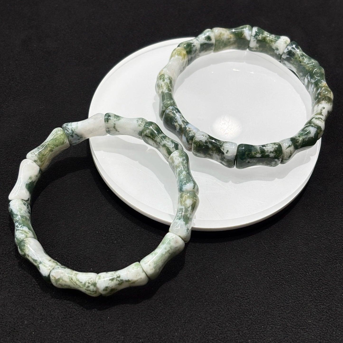 Detailed view of the yellow and blue tiger eye cylinder bead bracelet, focusing on the texture and color variations of the natural stone.