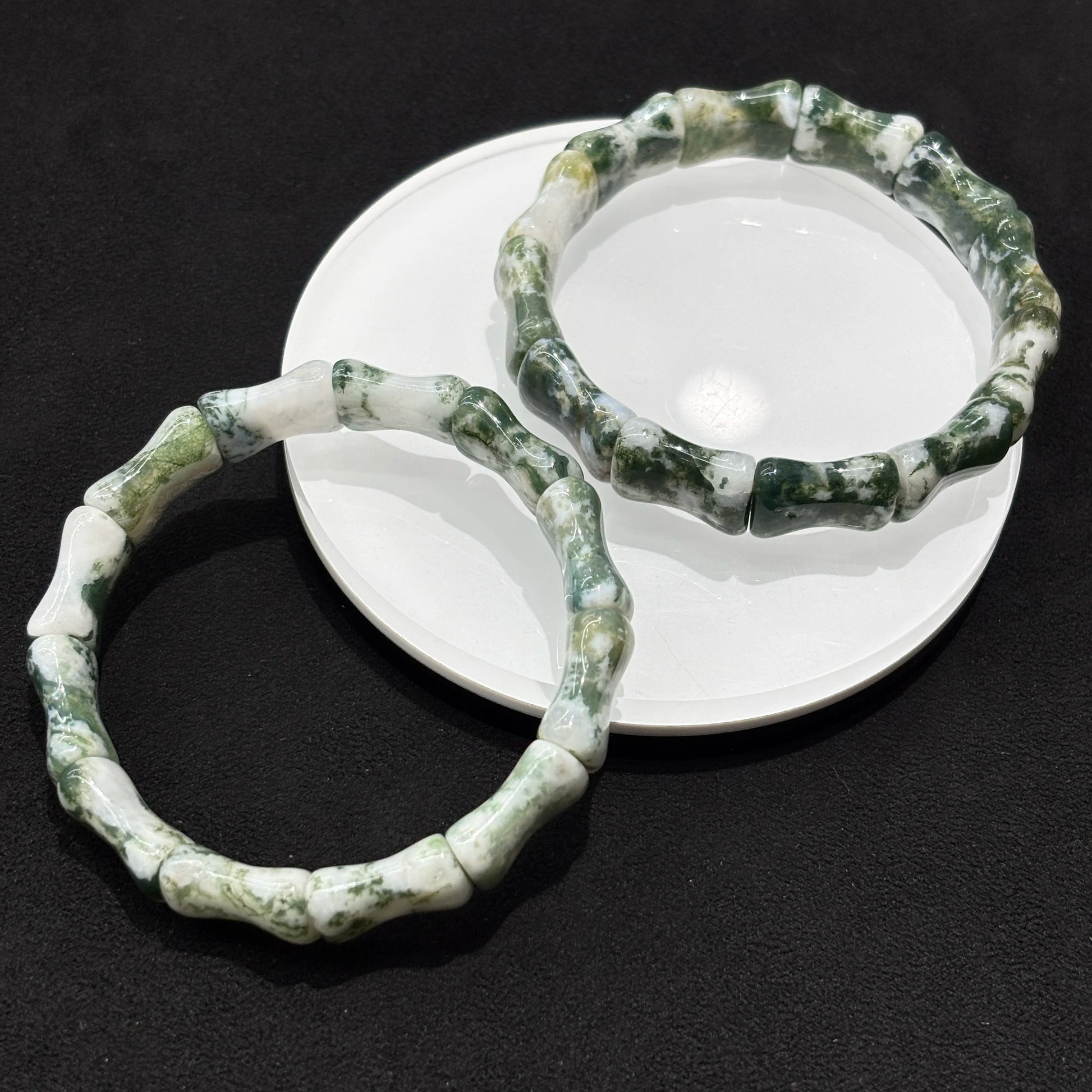 Detailed view of the yellow and blue tiger eye cylinder bead bracelet, focusing on the texture and color variations of the natural stone.