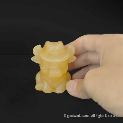 Translucent honey yellow calcite crystal cowboy bull figurine pocket size crystal carving