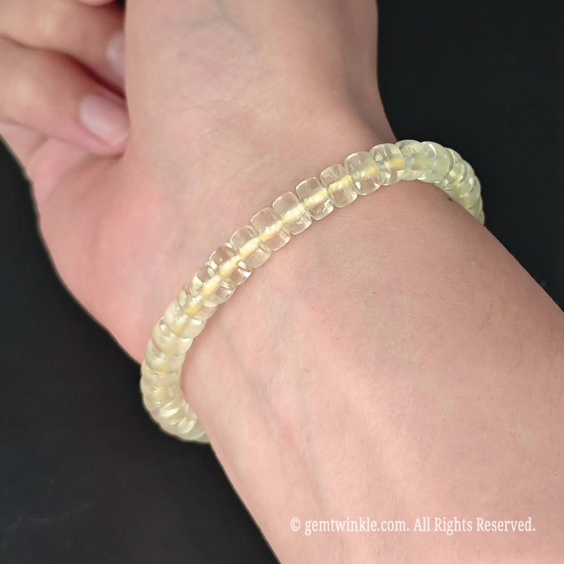 translucent lemon quartz wheel bead stretch bracelet on wrist