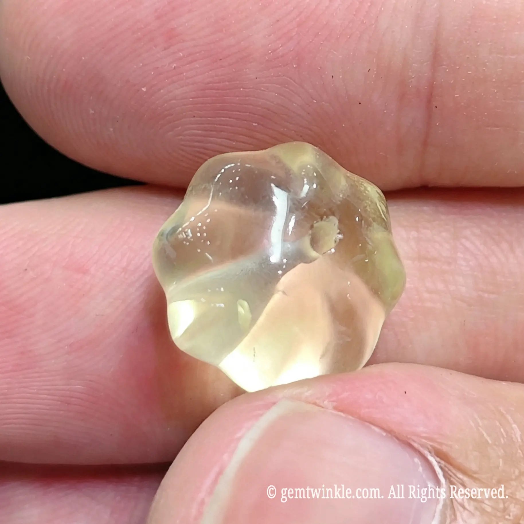 Top view of 12mm yellow quartz melon bead showing center hole drilling and carved ridges