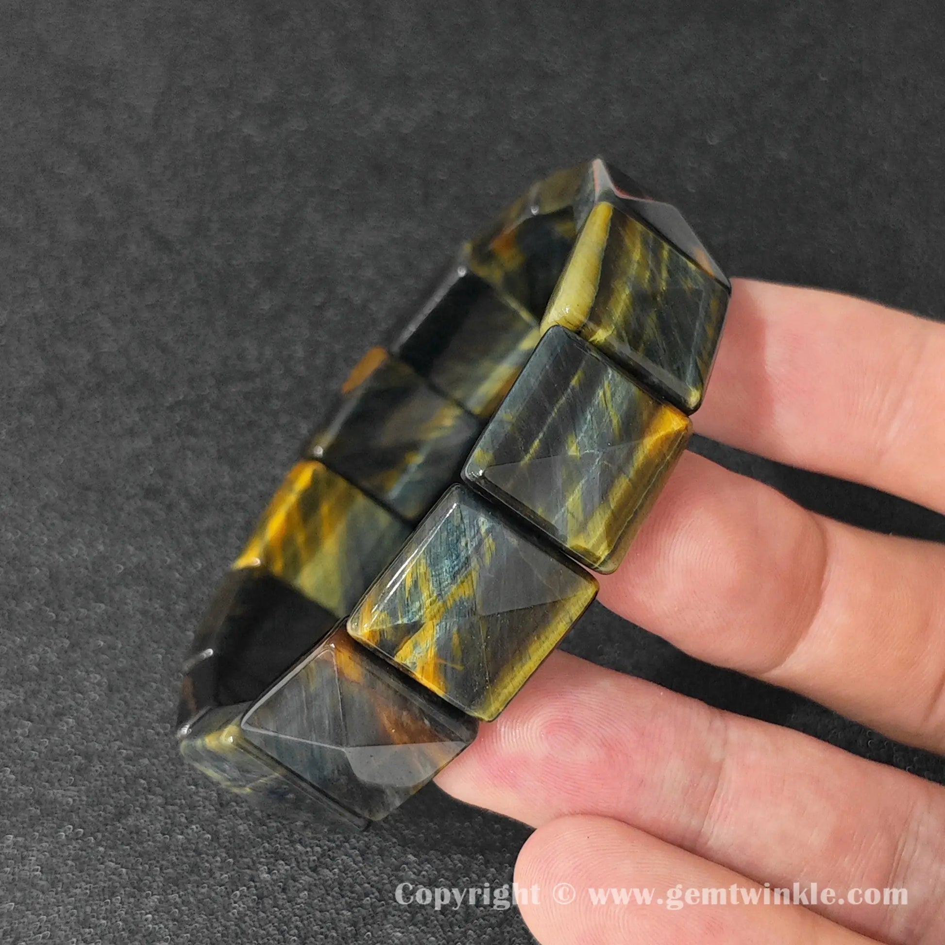 video preview of yellow blue tigers eye square pyramid bracelet rotated under studio light