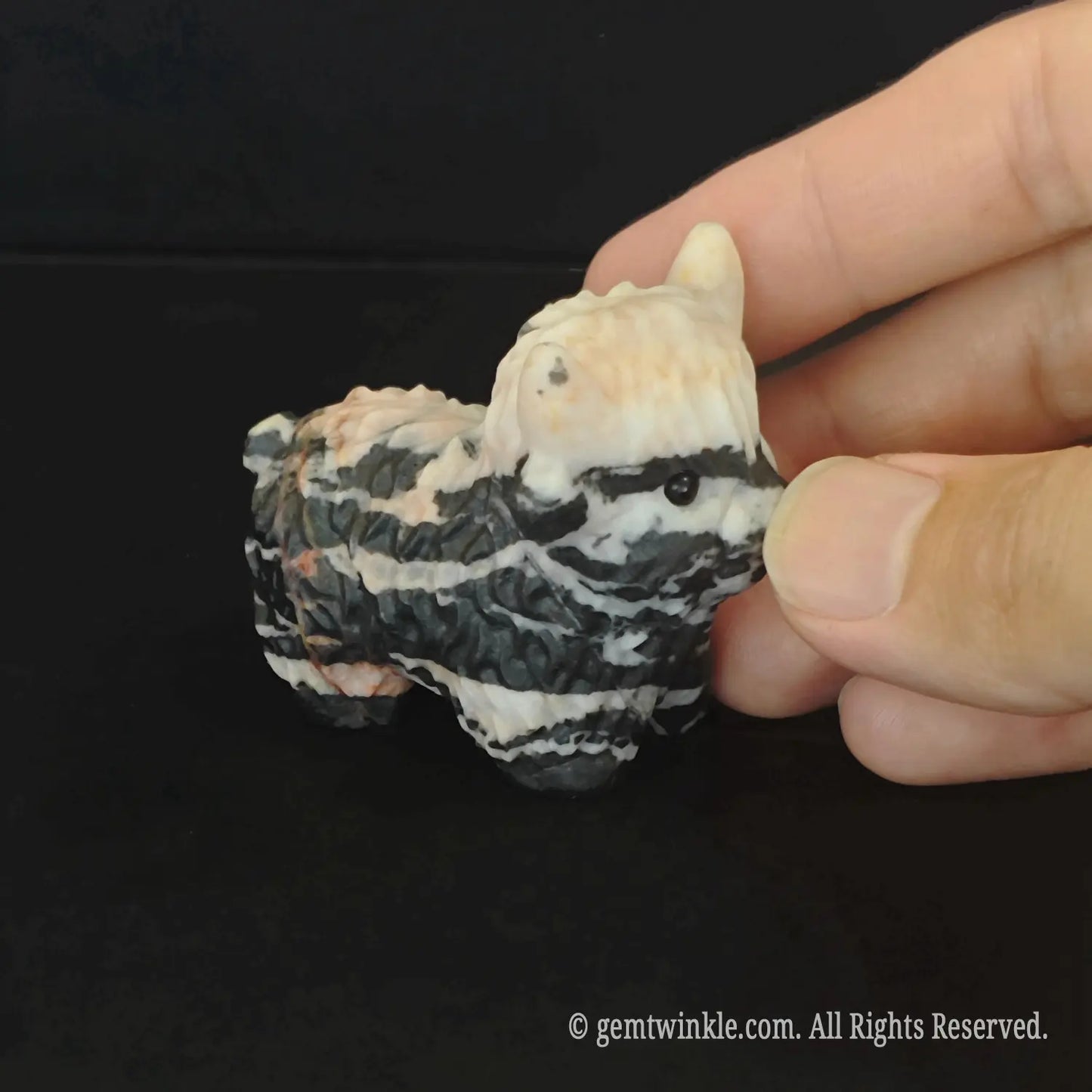 Natural zebra stripe stone sheep carving showing unique black and white curly wool textures